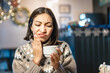 © EdNurg - Disgruntled asian woman took a sip of hot coffee and felt a sharp pain in her teeth. Hypersensitivity of the enamel and dental health problems