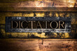© IHX - Dictator text on grungy textured authentic copper and gold background lined with bronze bars