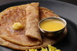 Puran Poli, also known as Holige, is an Indian sweet flatbread from India consumed mostly during Holi festival. Served in a plate with pure Ghee.