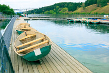 Boats Lying At The Boat Station On The Pier In The Process Of Drying And Inspection Before Renting