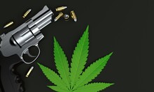 Cannabis Leaf With Gun And Ammunition
