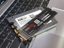 Different Types Of SSD Disk Drive Isolated On Laptop Keyboard. Classic SSD And SSD M2.