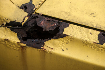 Wall Mural - Rusty part of old weathered vintage car body closeup