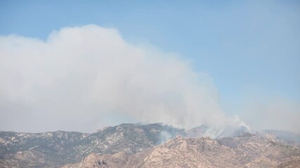 Wall Mural - Day to night timelapse of Bighorn fire smoke emissions and blaze, Tucson, Arizona