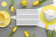 Good morning, breakfast, womens day, mothers day concept, yellow tulips, herbal tea,light box. Illuminating Yellow, Ultimate Gray, colors of the year 2021. Layered paper flatly.