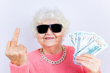 Blonde Old Lady Wear Pinl Sweater And Sunglasses Showing Money Isolated White Background She Is Showing Middle Finger