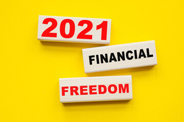 Wall Mural - words 2021 FINANCIAL FREEDOM written on ON A YELLOW BACKGROUND . You can use in business, marketing and other concepts.