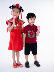 Wall Mural - Happy Chinese new year. Asian boy and girl in cheongsam of traditional chinese dress on white background.