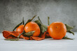 © Boris - tangerines with leaves on a light background