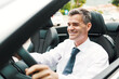 © StockPhotoPro - Man driving a brand new car