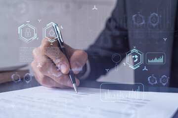 A client in dark blue suit is signing a contract to create a new software to present it in start up conference and gain investments to create a product. Technological graph over the desk.