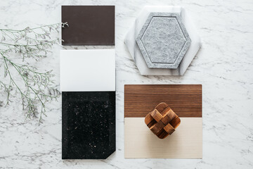 top view of material selections including granite tile, marble tile, acoustic tile, walnut and ash w