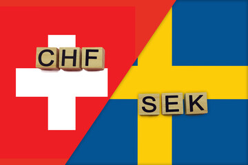 Switzerland and Sweden currencies codes on national flags background