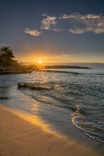 Boldly Colorful Hawaiian Seascapes During Sunset And Sunrise Include Surfers Sailboats And Fishermen In Silhouette.