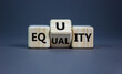 Equality or equity symbol. Turned a cube and changed the word 'equality' to 'equity'. Beautiful grey background. Psychology, business and equality or equity concept. Copy space.