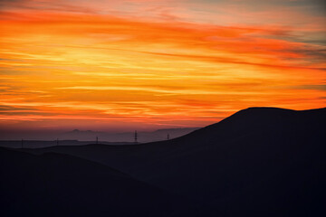 Wall Mural - Colorful sunset over the mountain hills. Beautiful landscape in Azerbaijan nature.