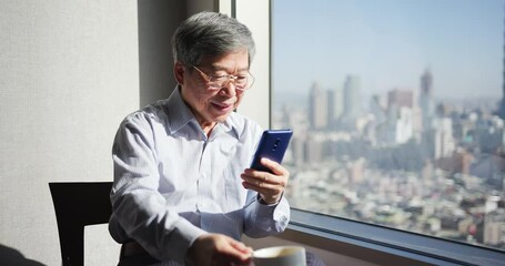 Sticker - man use smartphone near window