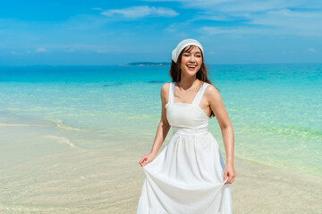 Wall Mural - cheerful woman on sea beach at Koh MunNork Island, Rayong, Thailand