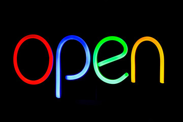 Wall Mural - 'OPEN' neon sign on black background 