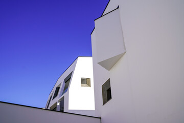 design facade white modern building in real new district in a blue sky