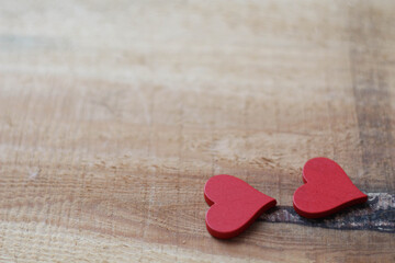 Two red Hearts for Valentine`s day concept on wood background. Love background