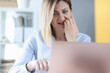 © megaflopp - Frightened woman looks into laptop monitor closeup