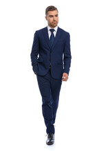 Confident Young Guy In Navy Blue Suit Holding Hand In Pocket