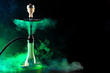 Smoking Hookah On Black Background With Color Fog