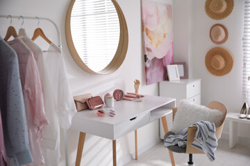 Poster - Dressing room interior with stylish makeup table, clothes and accessories