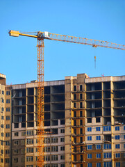 Wall Mural - Construction site. Building site with crane. Concrete building under construction