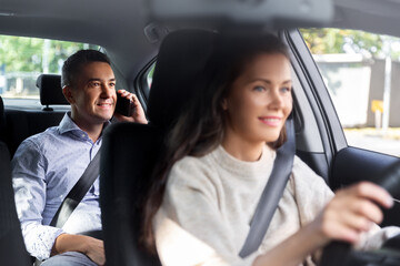 Sticker - transportation, vehicle and people concept - happy smiling male passenger calling on phone in taxi car