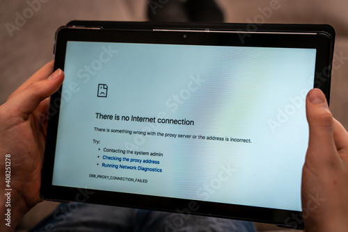 Hands holding tablet with no internet connection screen on the browser. Close up.