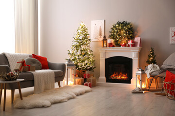 Wall Mural - Stylish living room interior with beautiful fireplace, Christmas tree