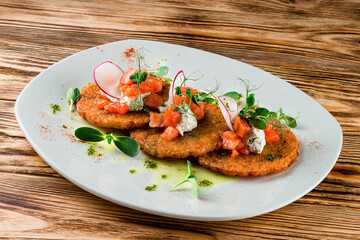 Sticker - Plate with tasty potato pancakes on wooden table