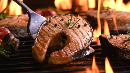 Poster - Grilled salmon fish with various vegetables on the flaming grill