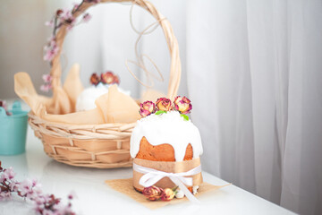 Wall Mural - Traditional russian easter cake on table. The decorarion of kulich are the flower are eating on spring holiday