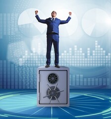 Poster - Businessman standing on top of safe