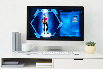 Modern workplace of video games designer with computer in studio