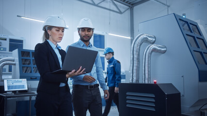 Aufkleber - Female Chief Engineer and Male Project Manager Walk Through Modern Factory, Talking and Planning Optimization of the Production. Industrial Facility: Professionals Working on CNC Machinery, robot arm