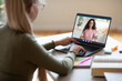 © Prostock-studio - Girl looking at laptop screen, having video chat with teacher