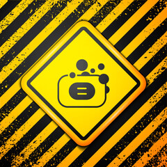 Wall Mural - Black Bar of soap icon isolated on yellow background. Soap bar with bubbles. Warning sign. Vector.