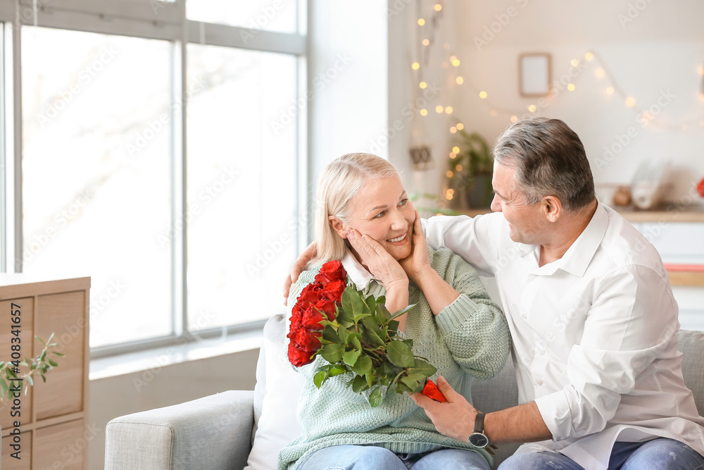 Mature couple celebrating Valentine's Day at home