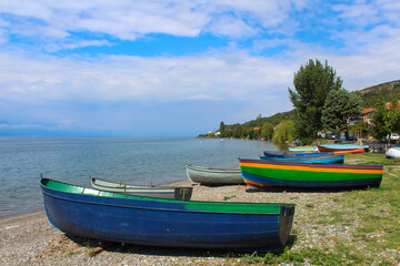  Colorful fishing boats on the lake Ohrid shore. Republic of North Macedonia