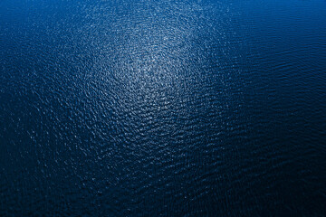 Poster - aerial view to deep blue water in river with sunlight