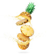 Sliced pineapple with splashing of juice in the air on white background