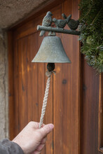 Person Ringing At Old Doorbell