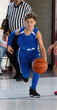 © Joe - Young athletic boy playing in a game of basketball