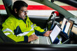 © Javier De La Torre Sebastian/Westend61 - Mature technician programming on laptop while sitting in electric car