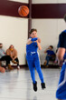 © Joe - Young athletic boy playing in a game of basketball