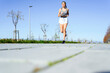 © Miguel Angel Partido Garcia/Westend61 - Athlete exercising while running on footpath during sunny day